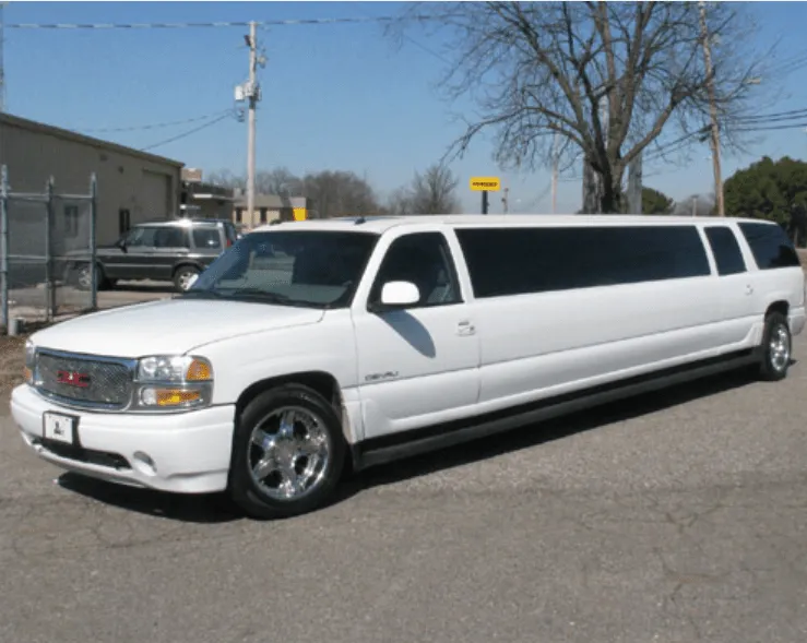 White GMC Denali Limousine exterior with tinted windows for limo rental White GMC Denali Limousine exterior with tinted windows for limo rental
