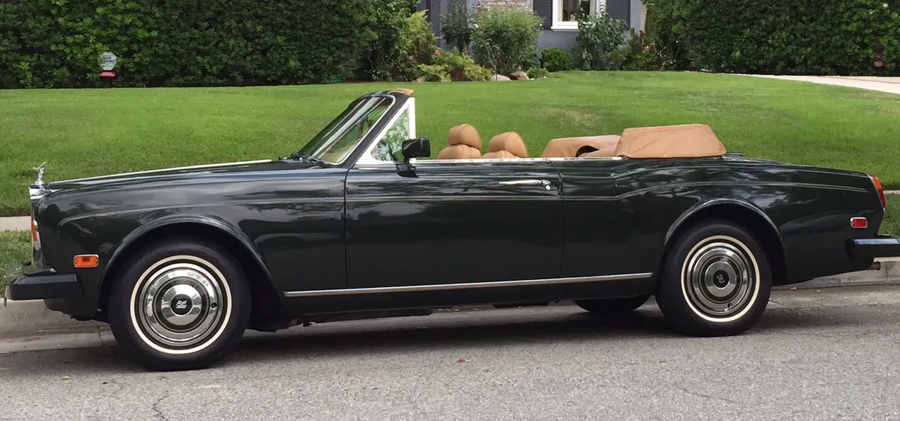 Green 1983 Rolls-Royce Corniche Convertible exterior with convertible roof, photo 11 for exotic and luxury car rental in Tarzana, CA