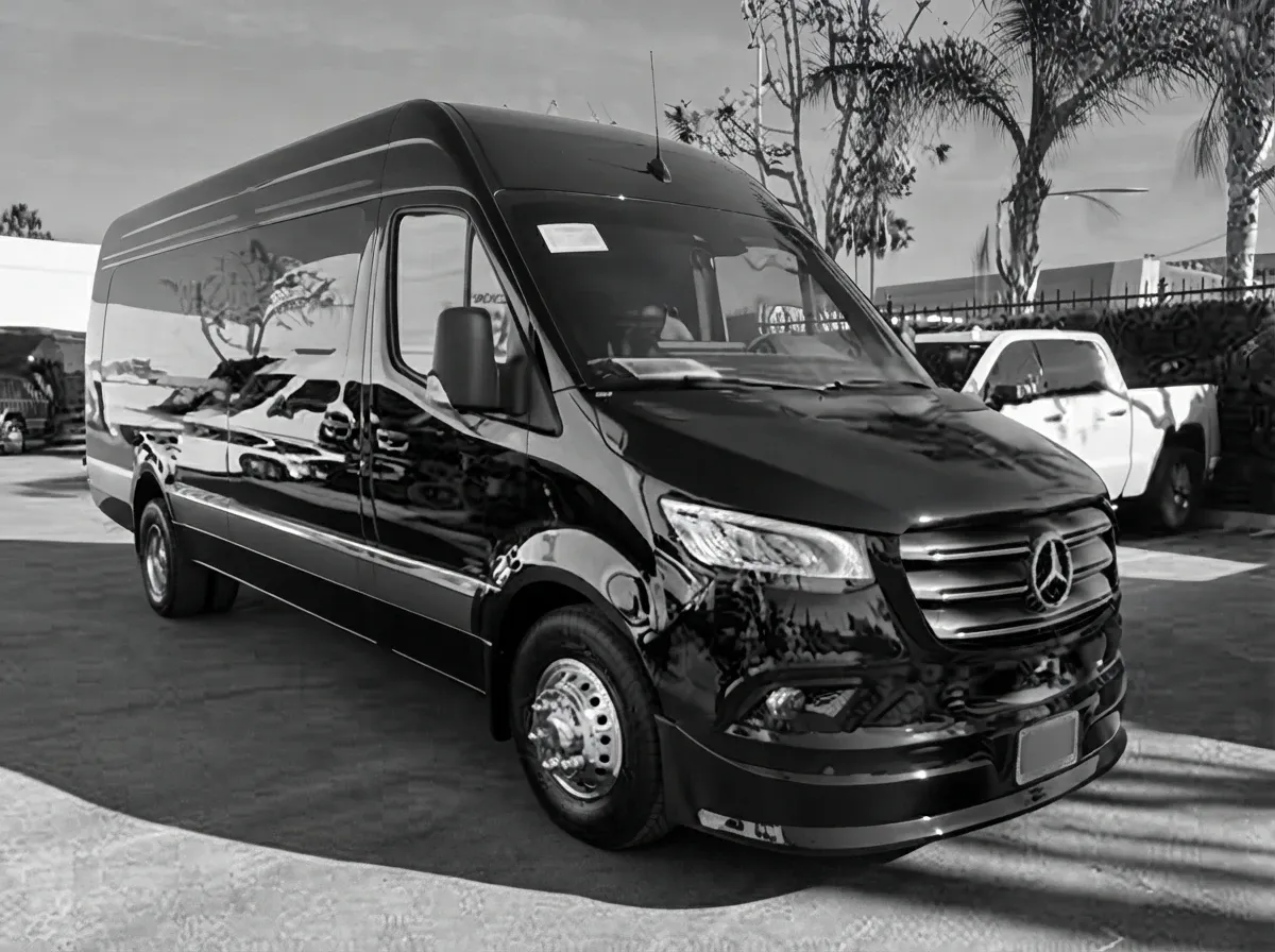 The black 2025 Mercedes-Benz Sprinter 13 Passenger Luxury Coach, ready to rent