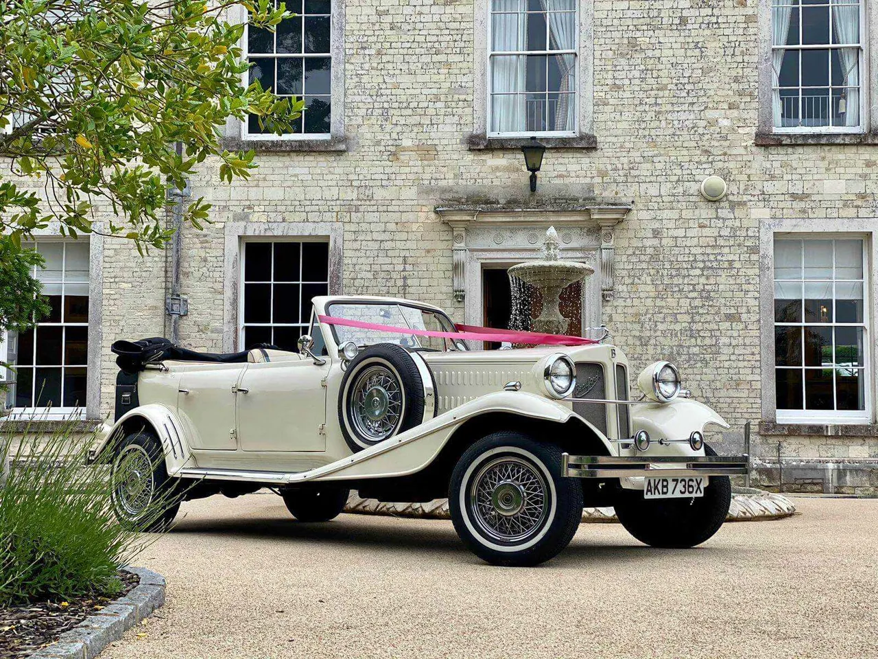 White Beauford 1920 with convertible roof for wedding car rental