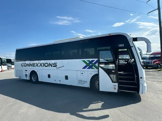 White 40 Passenger Charter Bus exterior for charter bus rental in Orlando, FL
