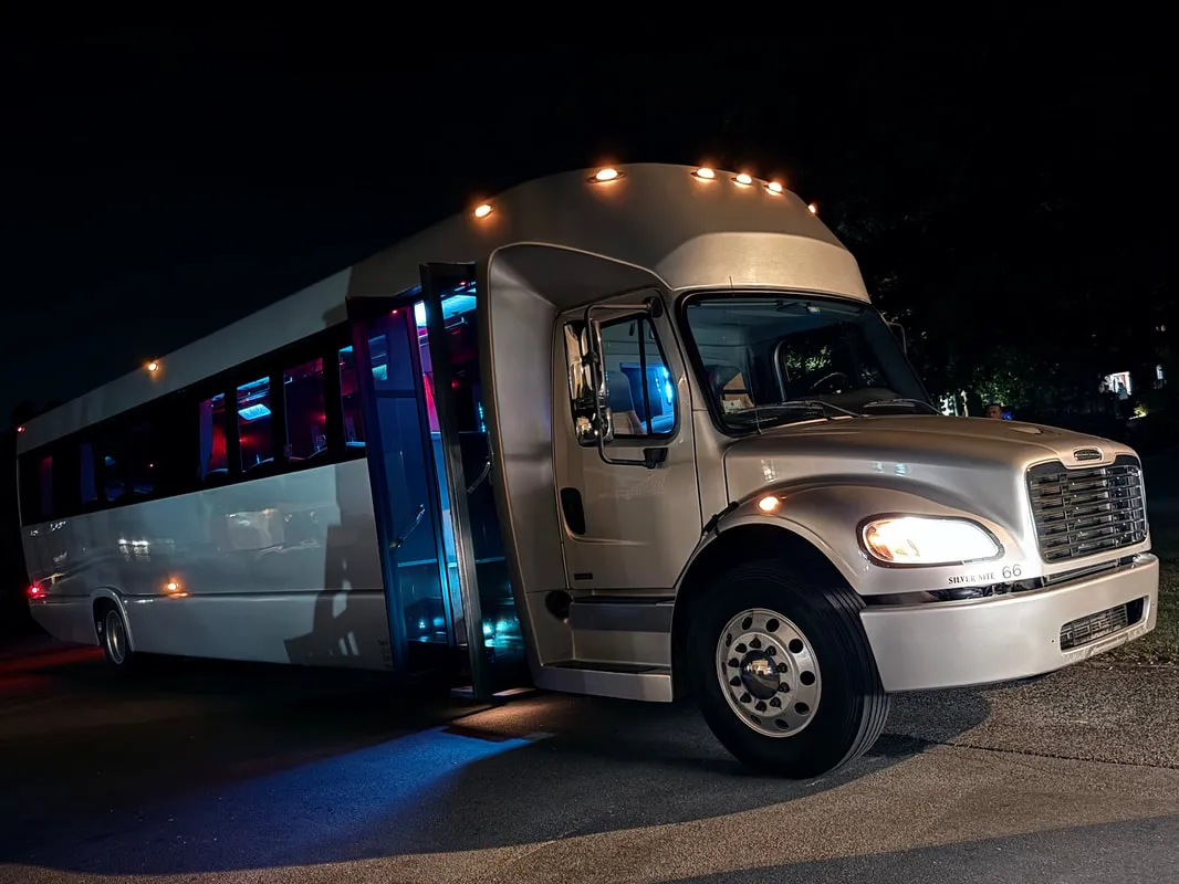 Silver Freightliner Party Bus exterior for party bus rental in North Attleboro, MA