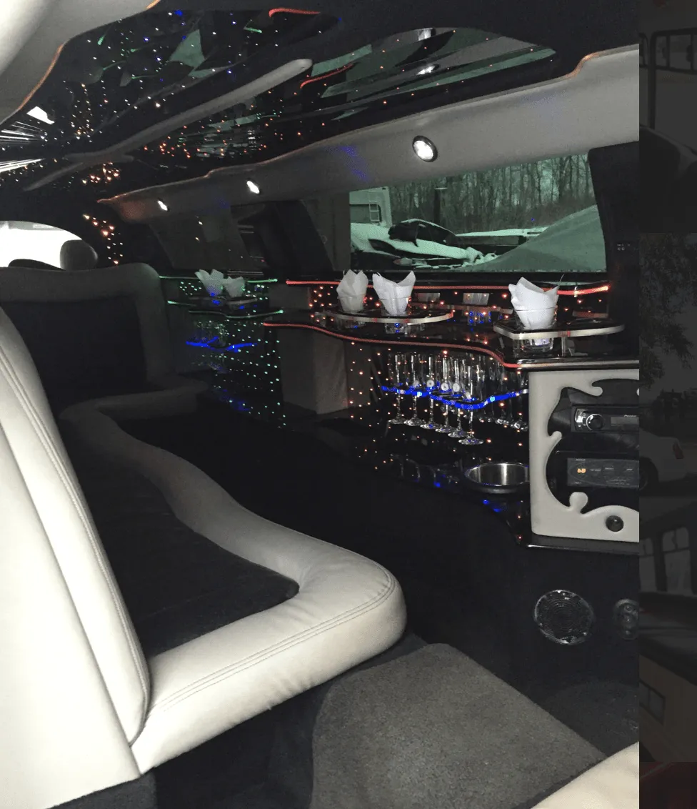 C300 Limousine interior with LED accent lighting, starlight or fiber-optic ceiling and bar area for limo rental in Duluth, MN