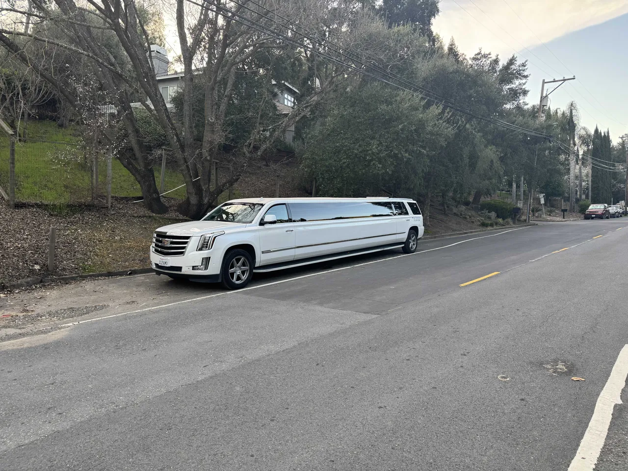 White Cadillac Escalade Limo with tinted windows for limo rental in Aptos, CA