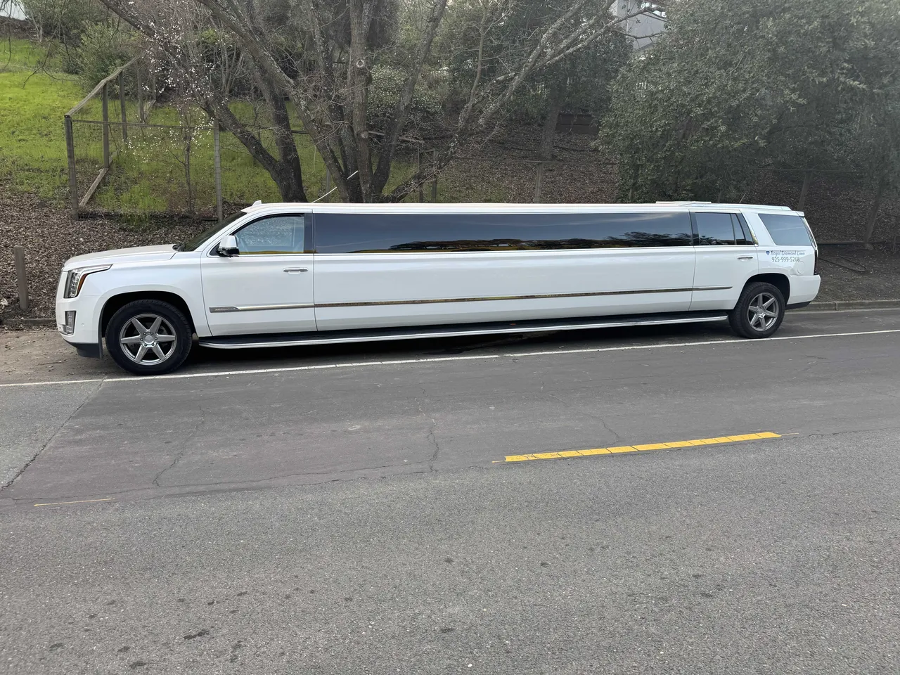 White Cadillac Escalade Limo exterior with tinted windows for limo rental in Aptos, CA