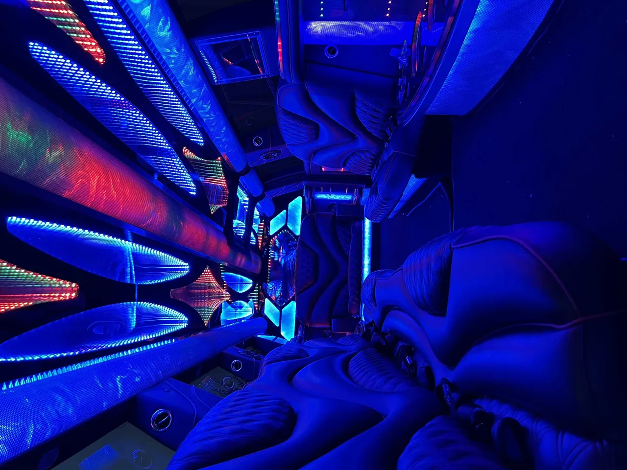 Cadillac Escalade Limo interior with LED accent lighting and LED ceiling lighting for limo rental in Aptos, CA