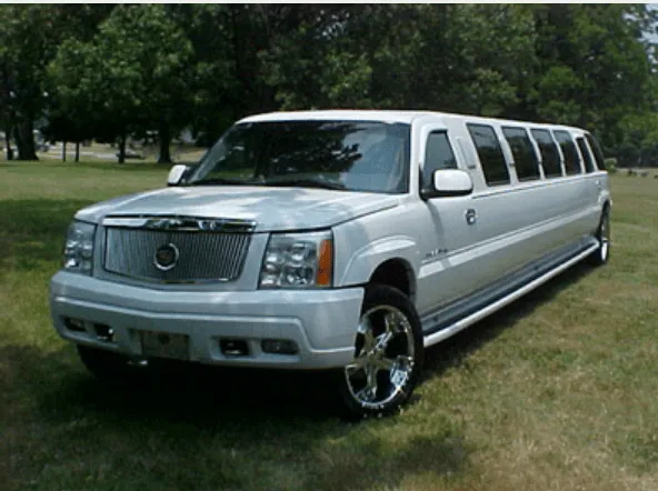 The white Cadillac Escalade Limousine, showing tinted windows and running boards