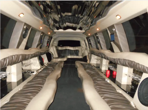 Inside of the Cadillac Escalade Limousine, showing perimeter lounge seating and mirrored ceiling
