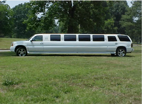From outside of the white Cadillac Escalade Limousine, showing tinted windows