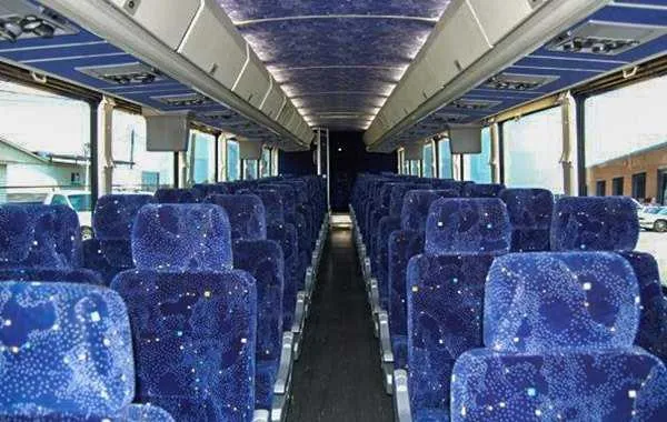 Inside of the 55 Passenger Charter Bus, showing overhead parcel racks