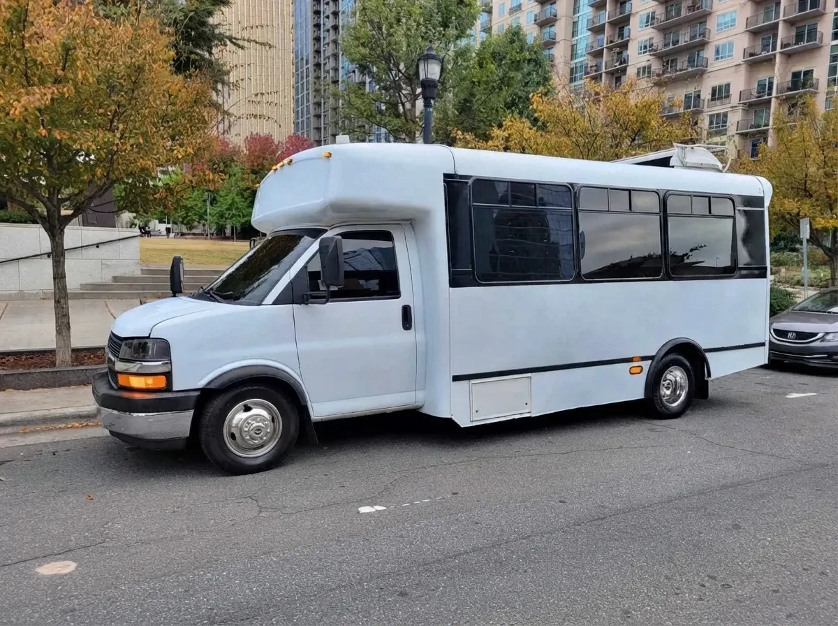 The white Chevrolet Party Bus, ready to rent