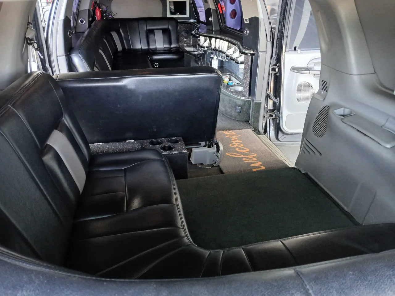 Excursion Limousine interior with cup holders for limo rental in Walnut, CA