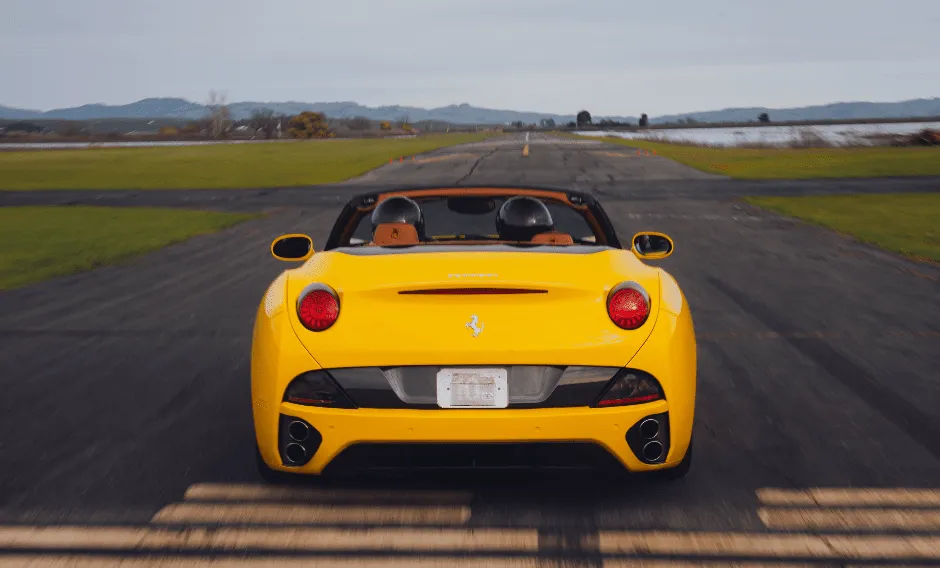 Yellow Ferrari California Convertible with convertible roof for wedding car rental in Dutch Flat, CA