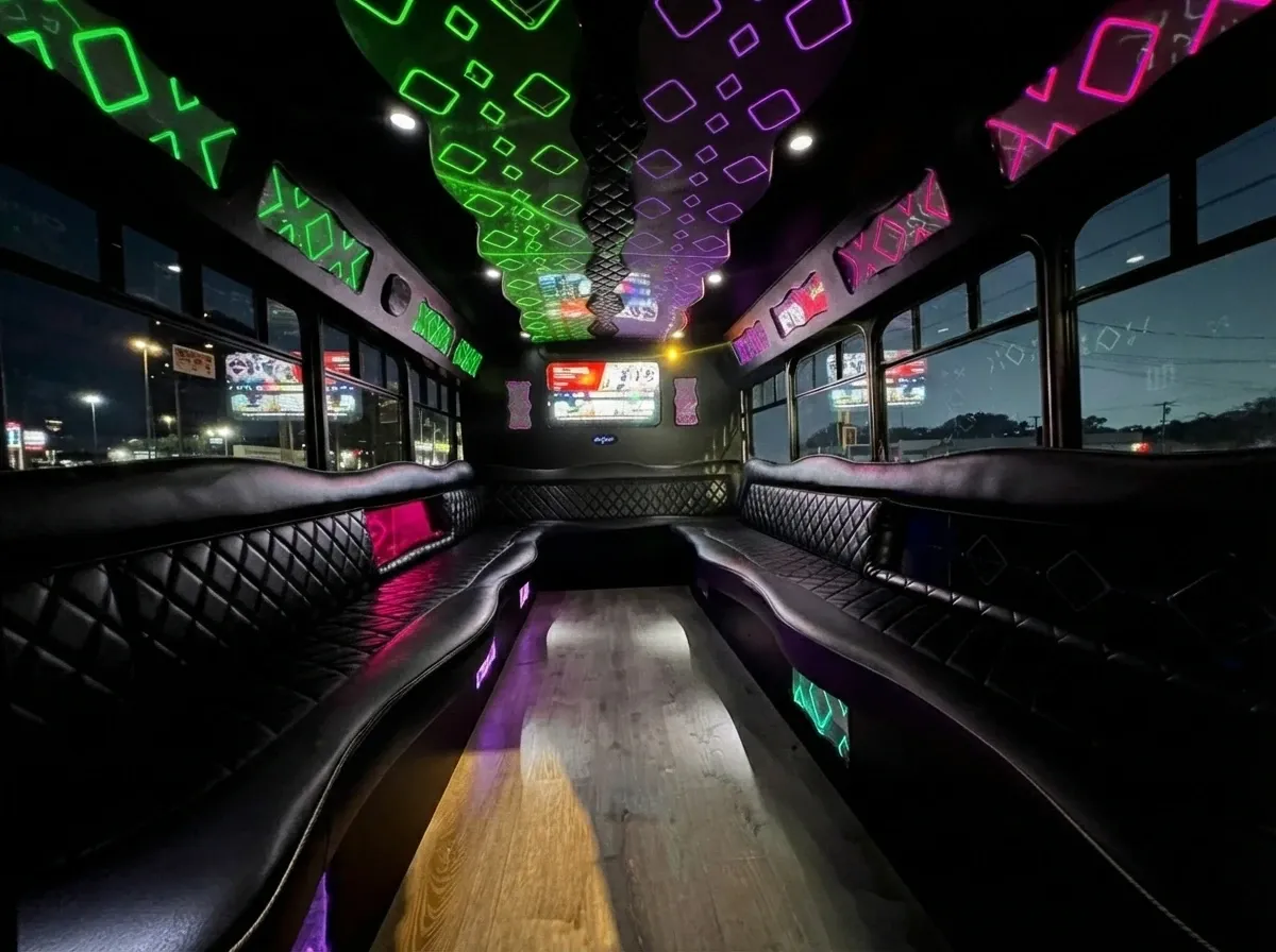 The white Ford E-450 Series Party Bus, shot 3