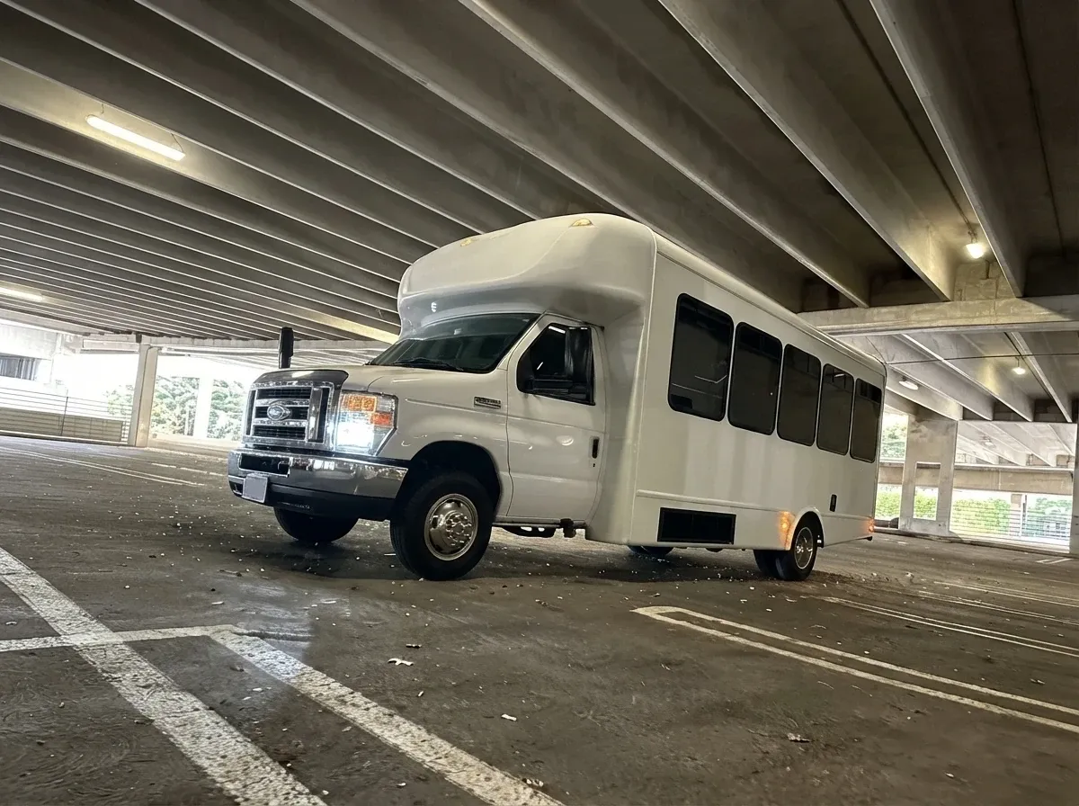 The white Ford E-450 Series Party Bus, shot 4