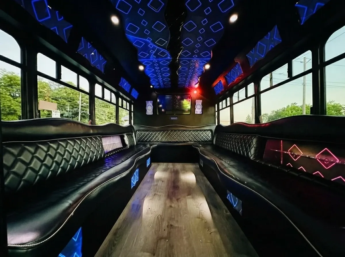 The white Ford E-450 Series Party Bus, shot 6