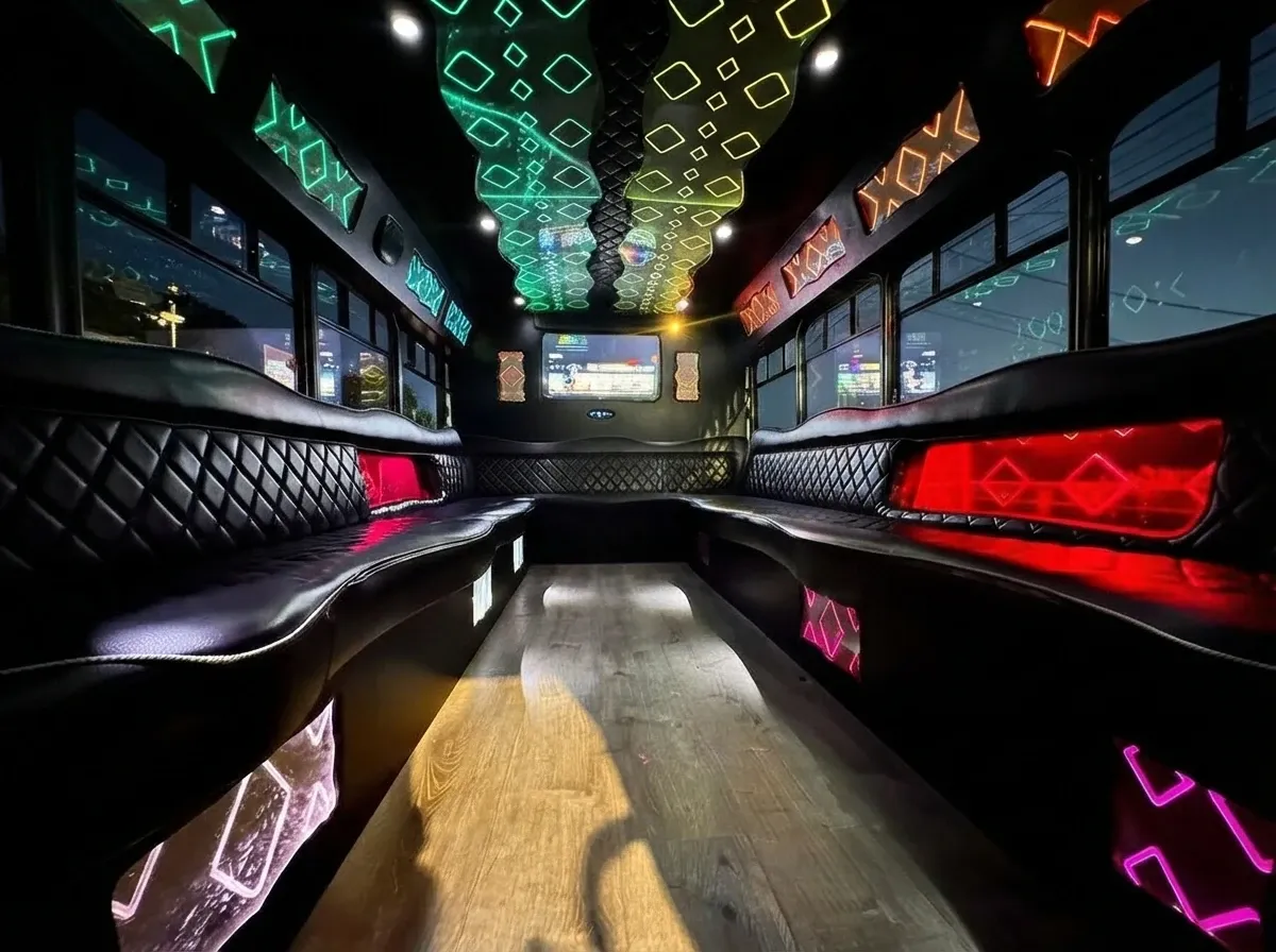 The white Ford E-450 Series Party Bus, shot 5