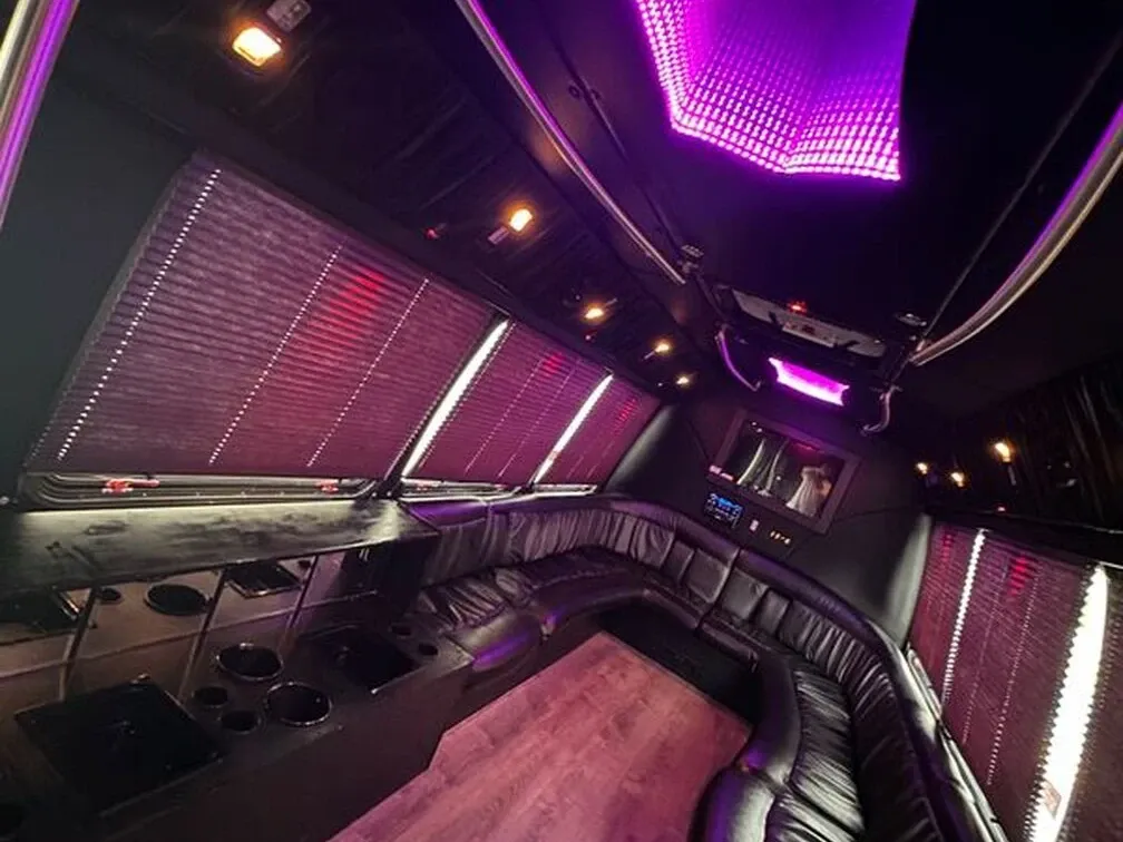 The white Ford E-450 Series Party Bus, shot 6