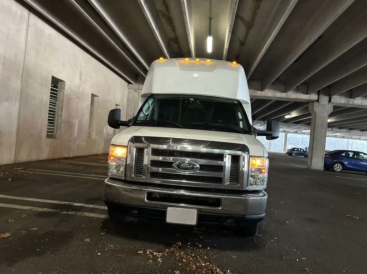 The white Ford E-450 Series Party Bus, shot 12