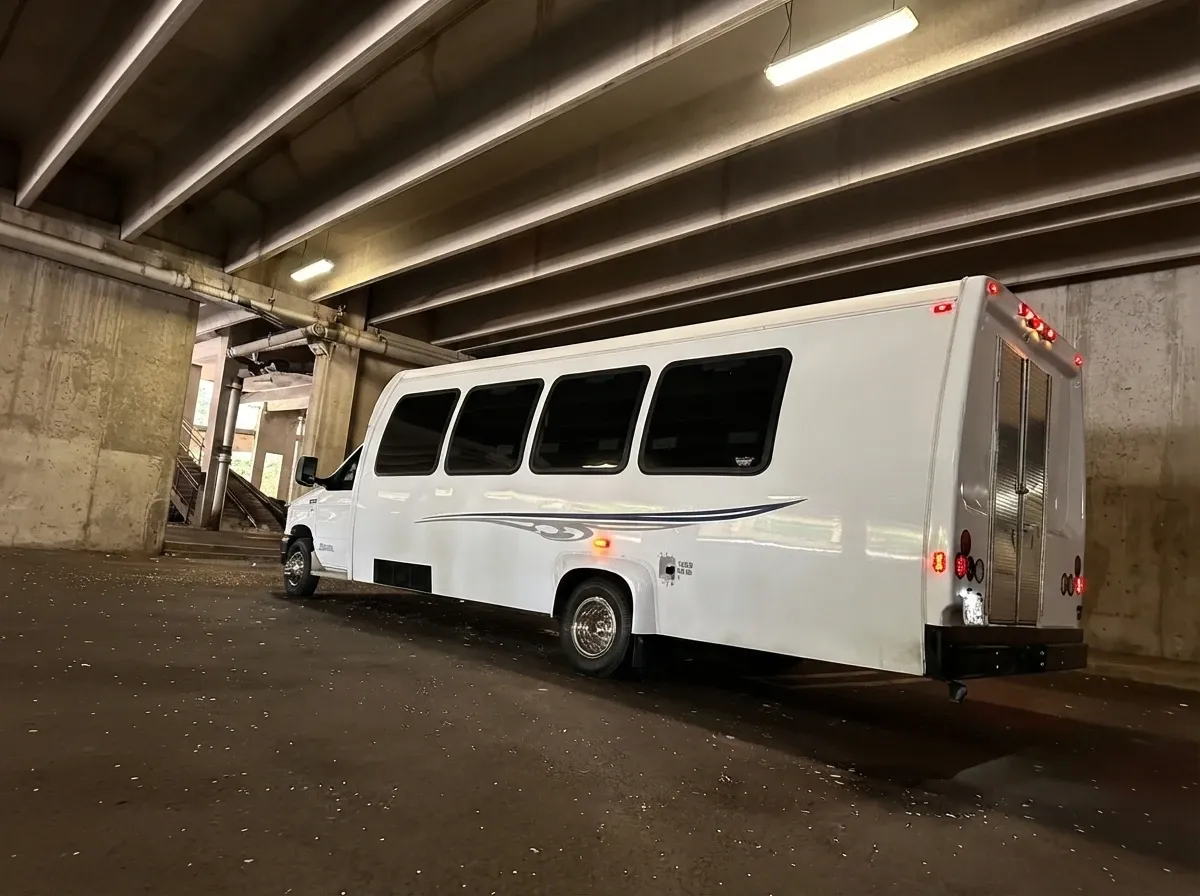 The white Ford E-450 Series Party Bus, shot 11