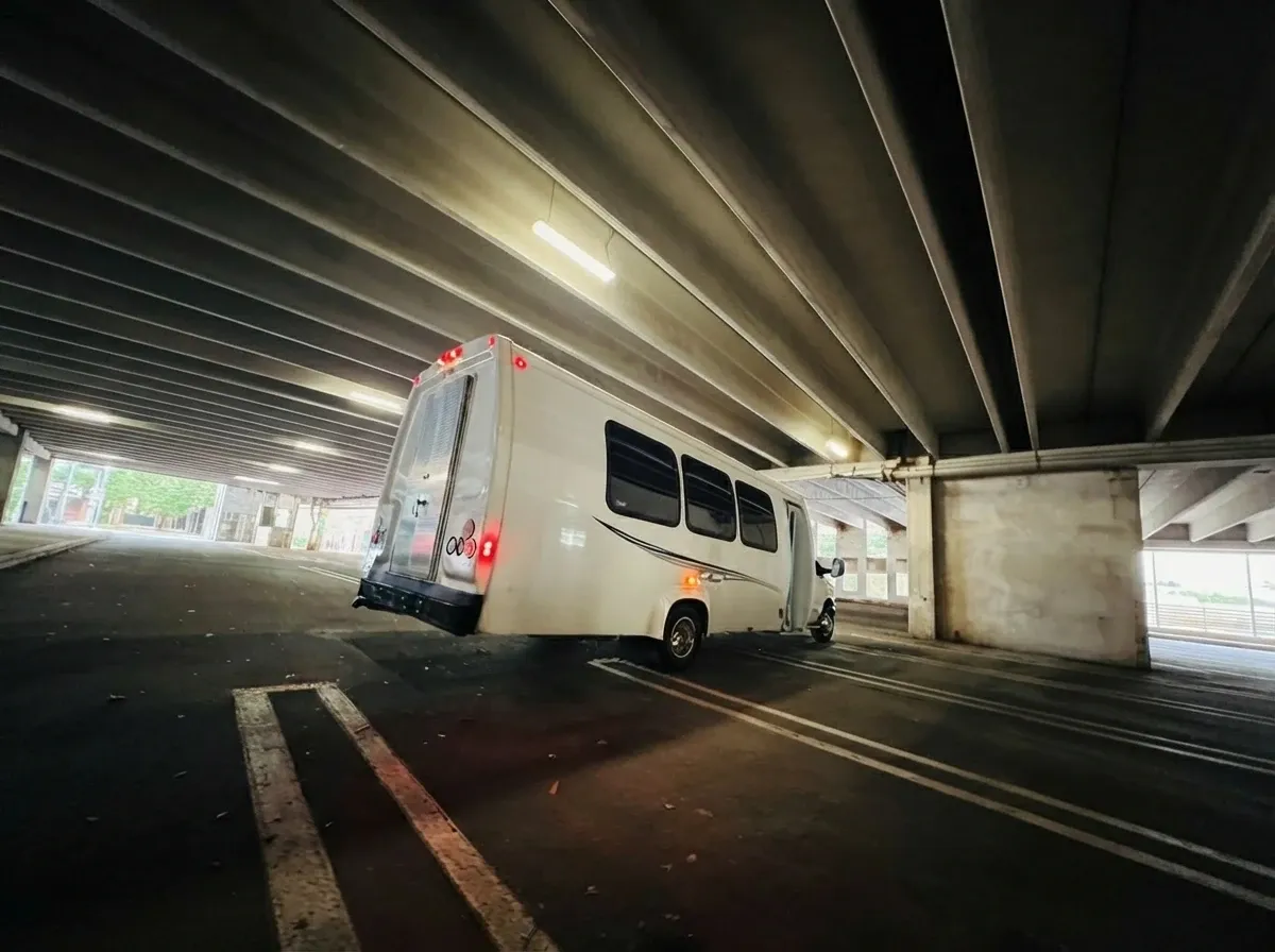 The white Ford E-450 Series Party Bus, shot 4