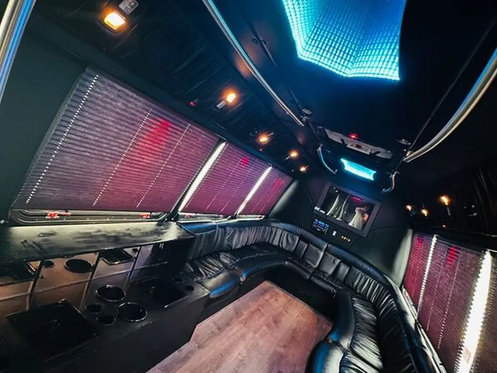 The white Ford E-450 Series Party Bus, shot 5