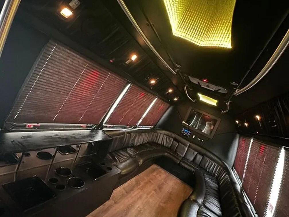 The white Ford E-450 Series Party Bus, shot 10