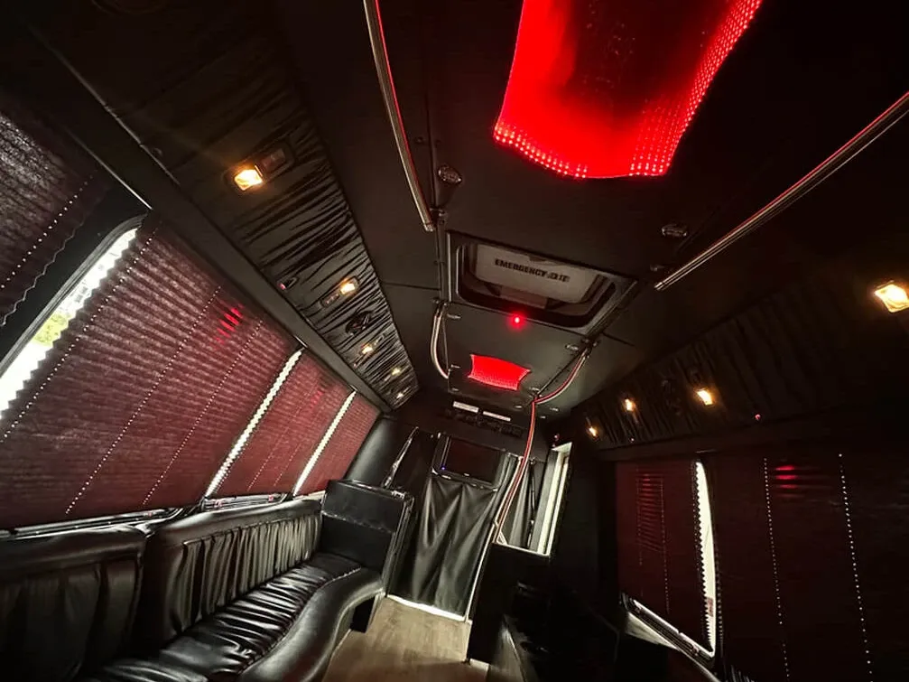 The white Ford E-450 Series Party Bus, shot 8