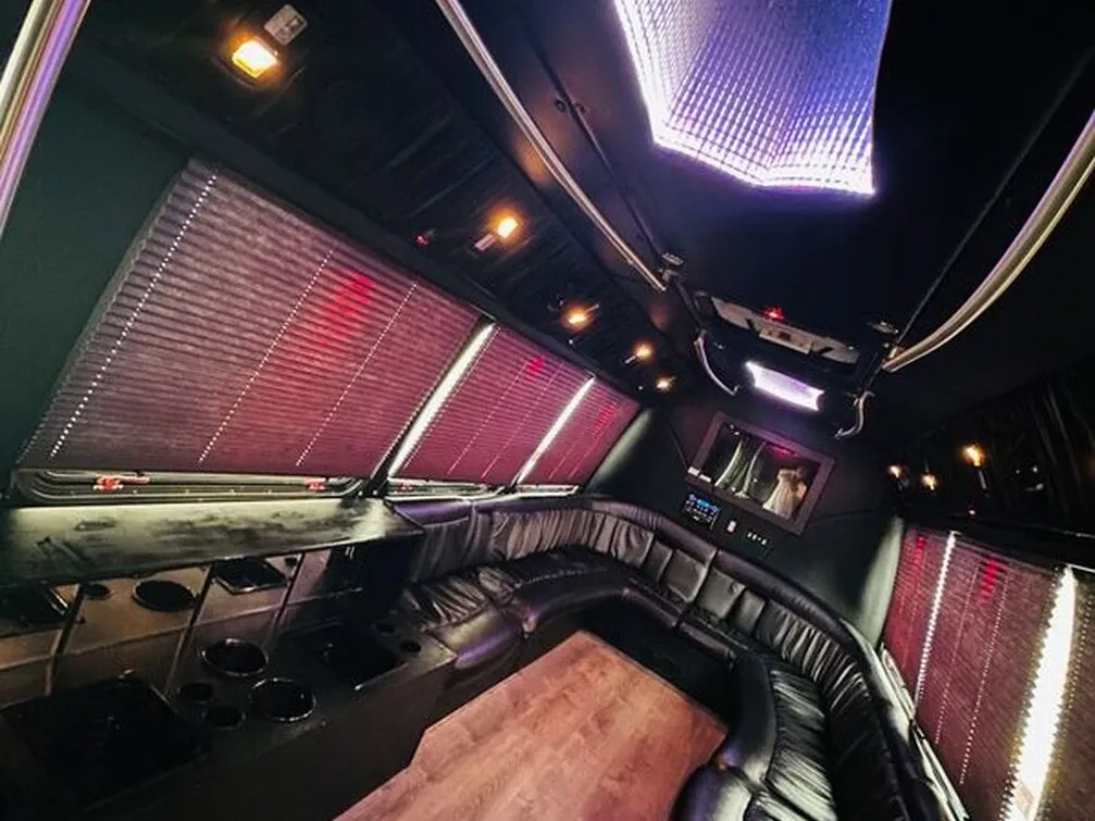 The white Ford E-450 Series Party Bus, shot 3