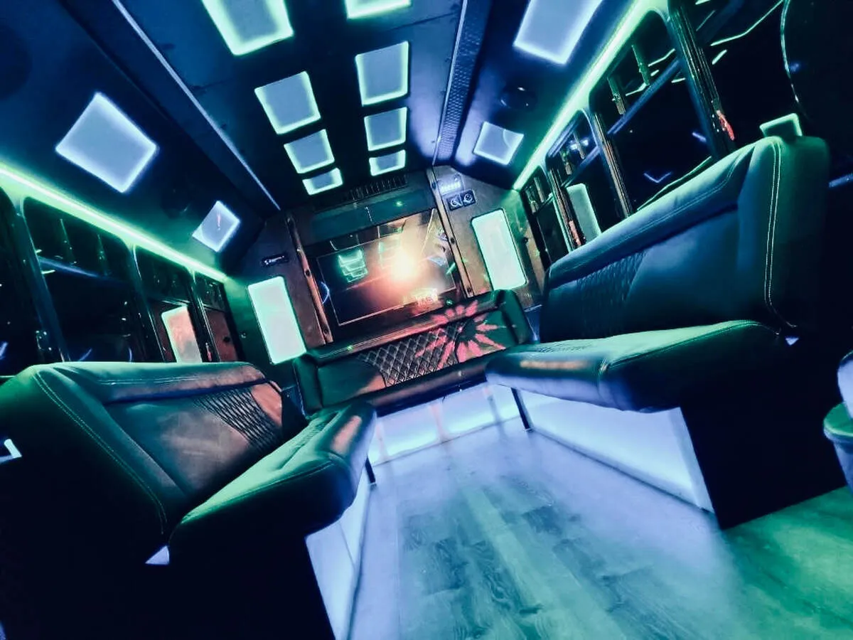 Ford E-450 Series Party Bus interior with perimeter lounge seating, LED accent lighting and LED ceiling lighting, photo 2 for party bus rental in North Attleboro, MA