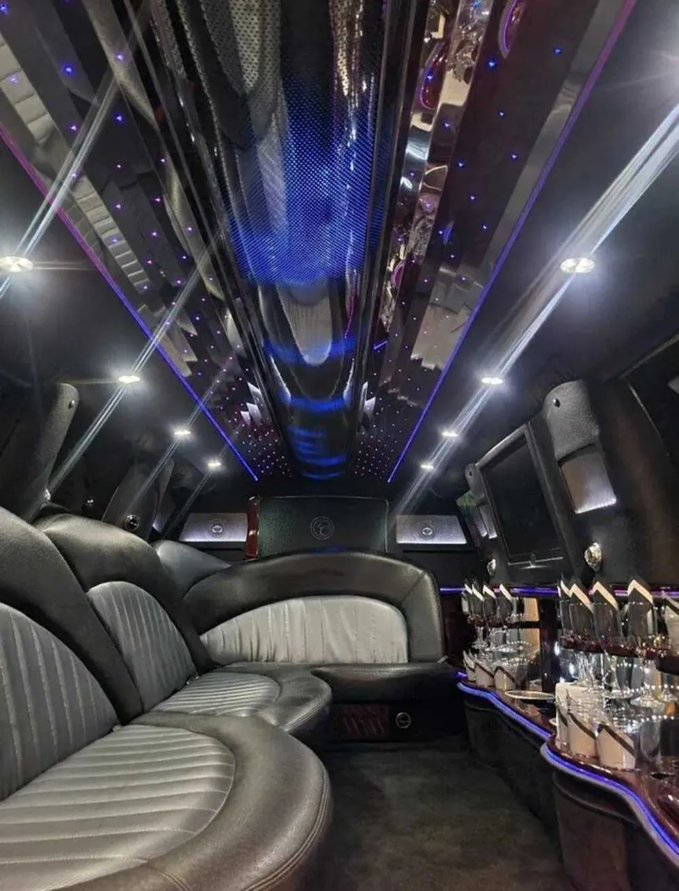 Ford Expedition Limousine interior with LED accent lighting, starlight or fiber-optic ceiling and mirrored ceiling for limo rental in Schertz, TX