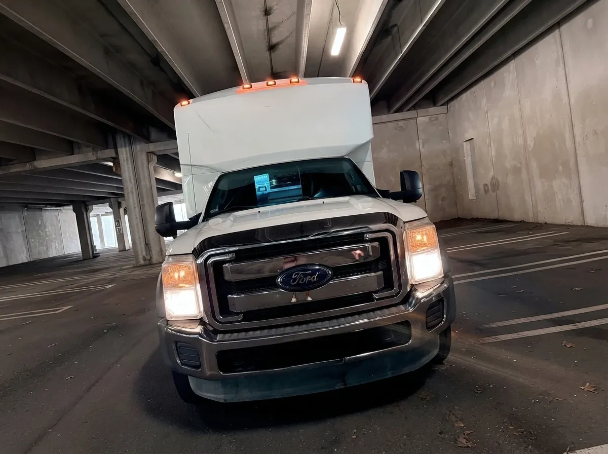 The white Ford F-550 Party Bus, shot 12