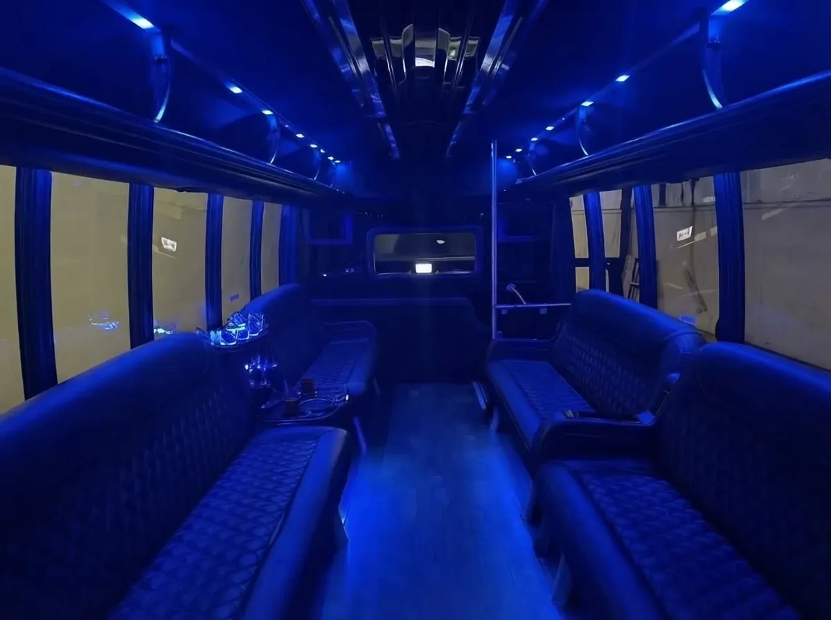 The black Ford F550 Party Bus Limousine, shot 2