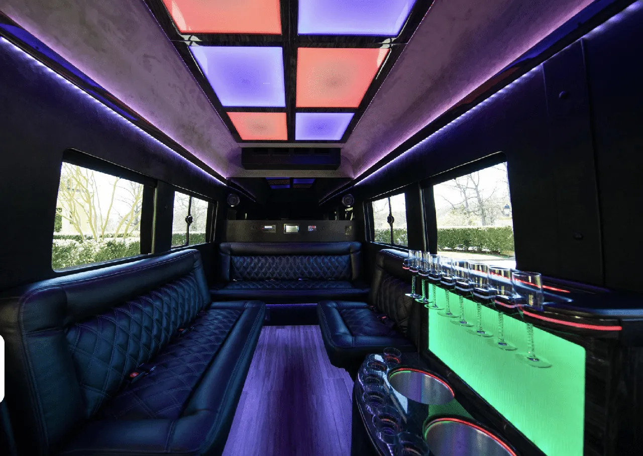 Ford Limousine Van interior with sofa-style seating, LED accent lighting and LED ceiling lighting for party bus rental