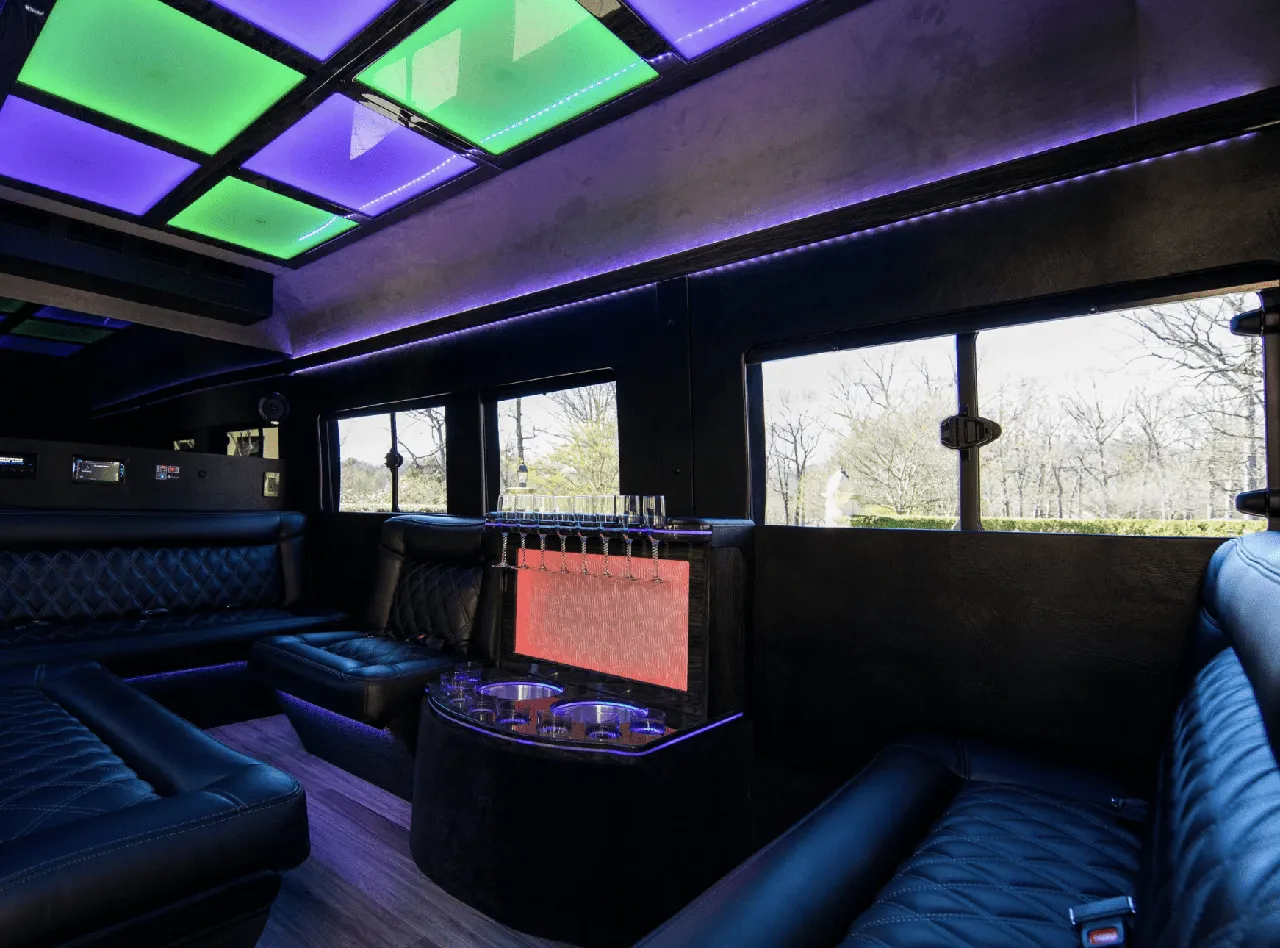Ford Limousine Van interior with sofa-style seating, LED accent lighting and LED ceiling lighting, photo 2 for party bus rental