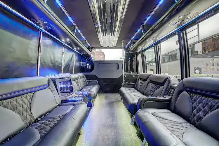Grech Party Bus interior with perimeter lounge seating, sofa-style seating and LED accent lighting, photo 2 for party bus rental in Saint Paul, MN