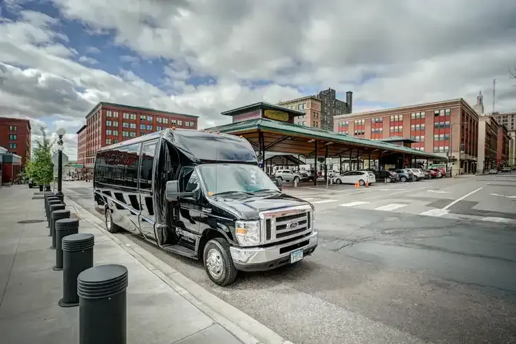 Black Grech Party Bus exterior with tinted windows for party bus rental in Saint Paul, MN
