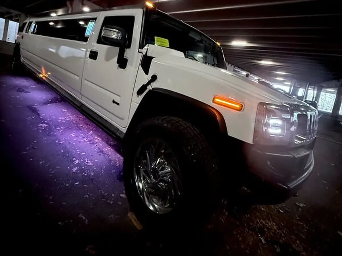 White H2 Hummer The white H2 Hummer, ready to rent