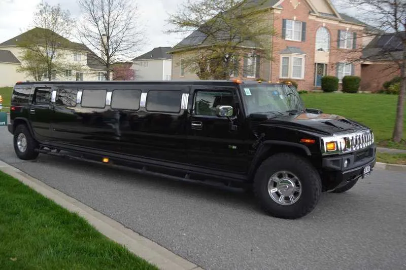Black Hummer H2 Limousine with tinted windows for limo rental