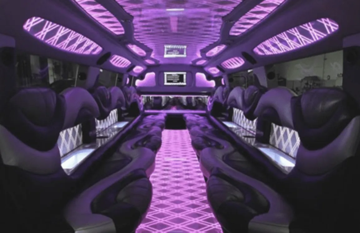 Hummer Limousine interior with perimeter lounge seating, LED accent lighting and LED ceiling lighting for limo rental in Bradshaw, NE