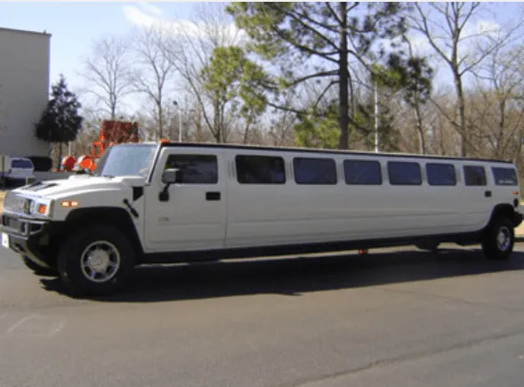 The white Hummer Limousine, showing tinted windows