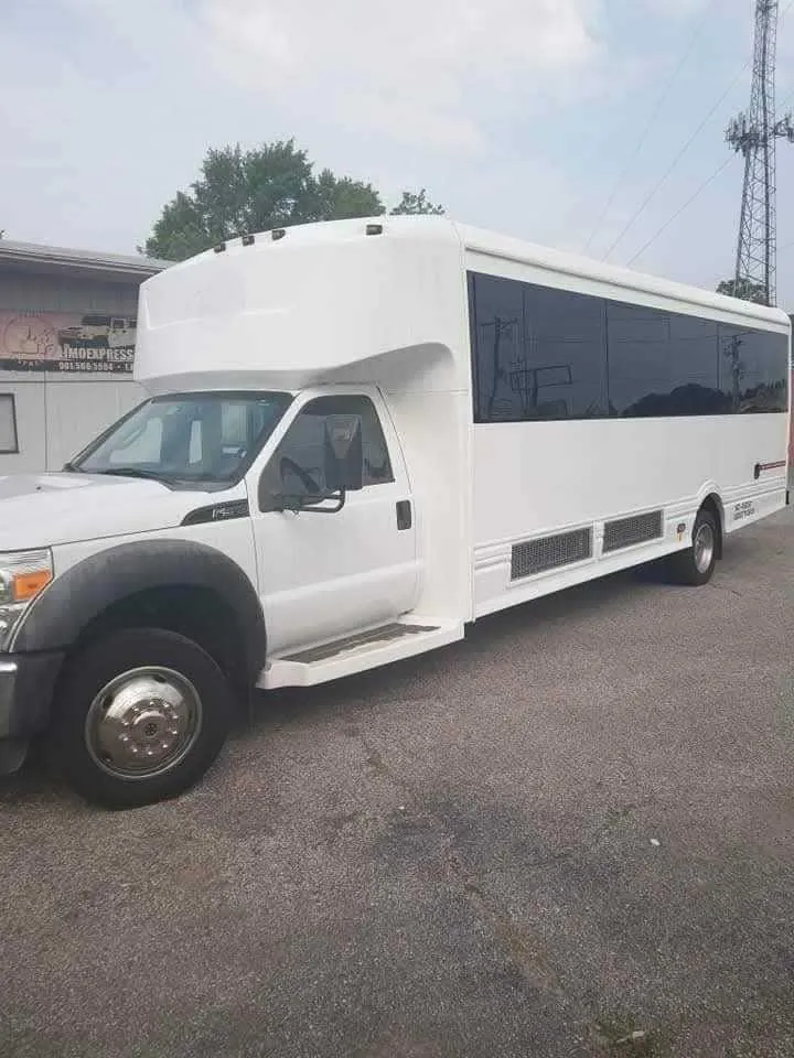Silver Limousine Bus exterior with tinted windows, photo 6 for party bus rental