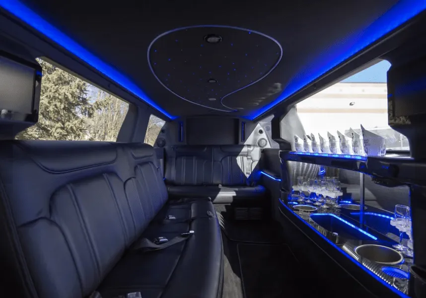 Lincoln MKT Limo interior with LED accent lighting, starlight or fiber-optic ceiling and bar area for limo rental in Gresham, NE