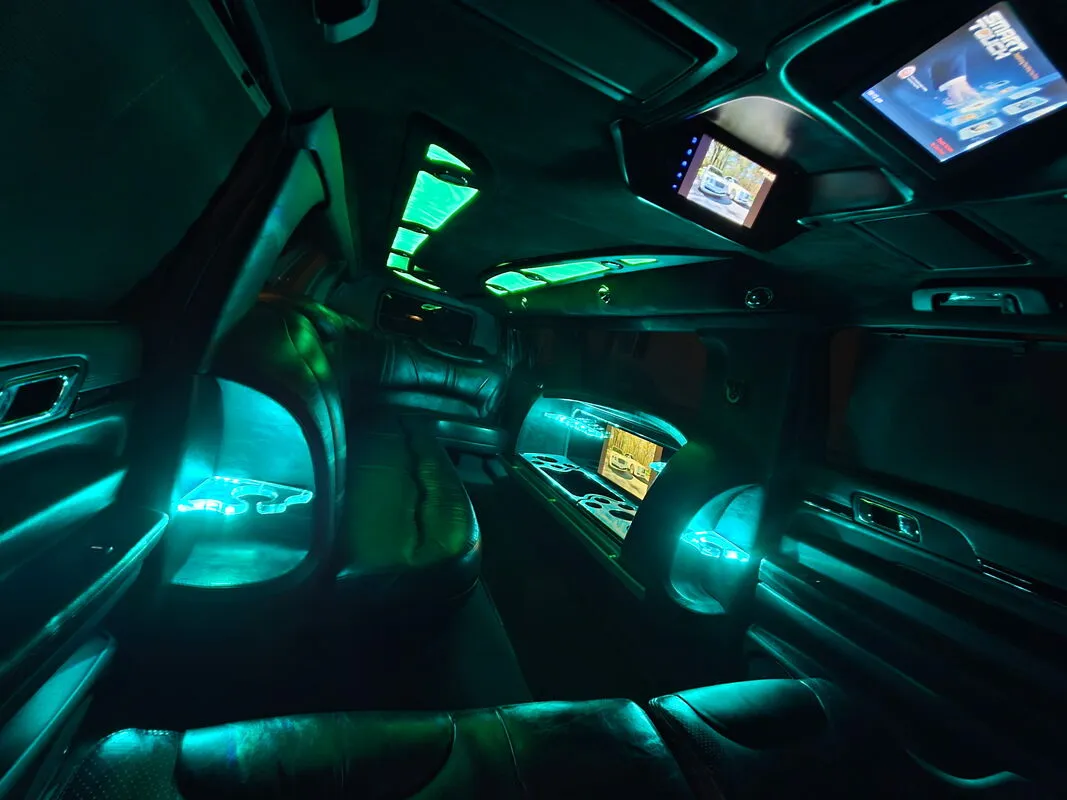 Lincoln MKT Limousine interior with LED accent lighting and TV screens, photo 4 for limo rental