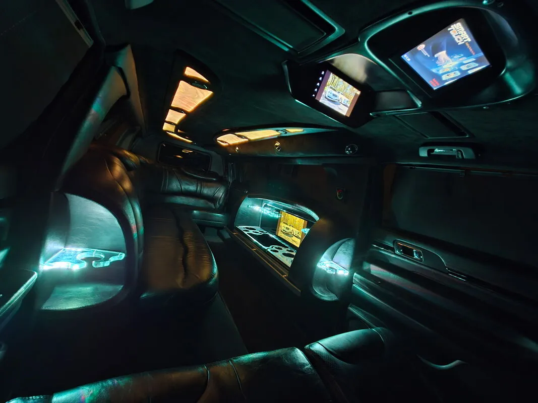 Lincoln MKT Limousine interior with LED accent lighting and TV screens, photo 6 for limo rental