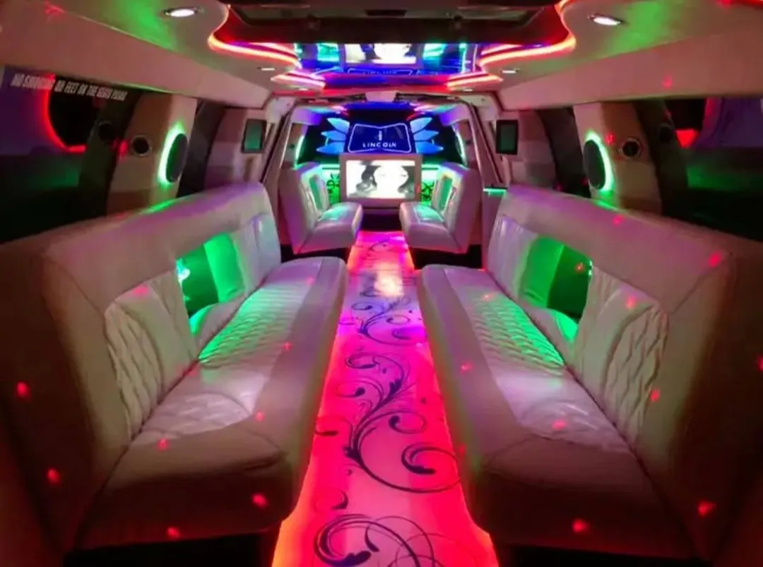 18 Passenger Lincoln Navigator interior with LED accent lighting and TV screens for limo rental