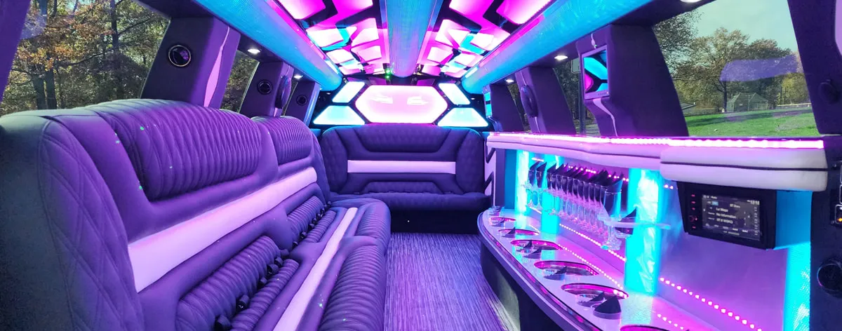 22 Passenger Lincoln Navigator interior with LED accent lighting, LED ceiling lighting and bar area for limo rental