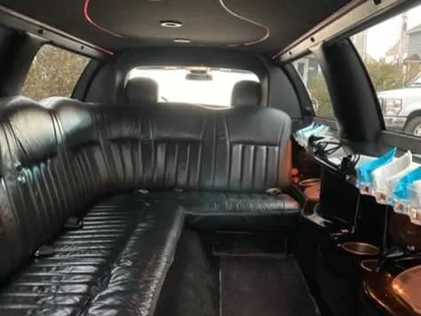 The white Lincoln Town Car, ready to rent