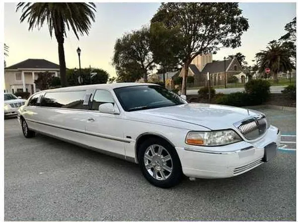 The white Lincoln Town Car Limousine, ready to rent