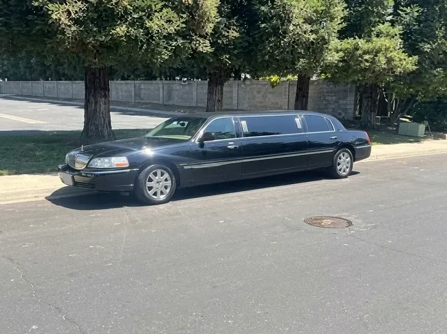 The black Lincoln Town Car Limousine, ready to rent